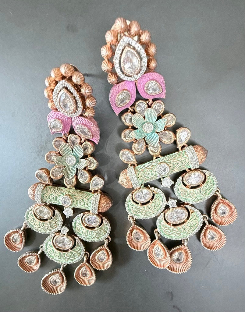 Ornate earrings with intricate designs on 