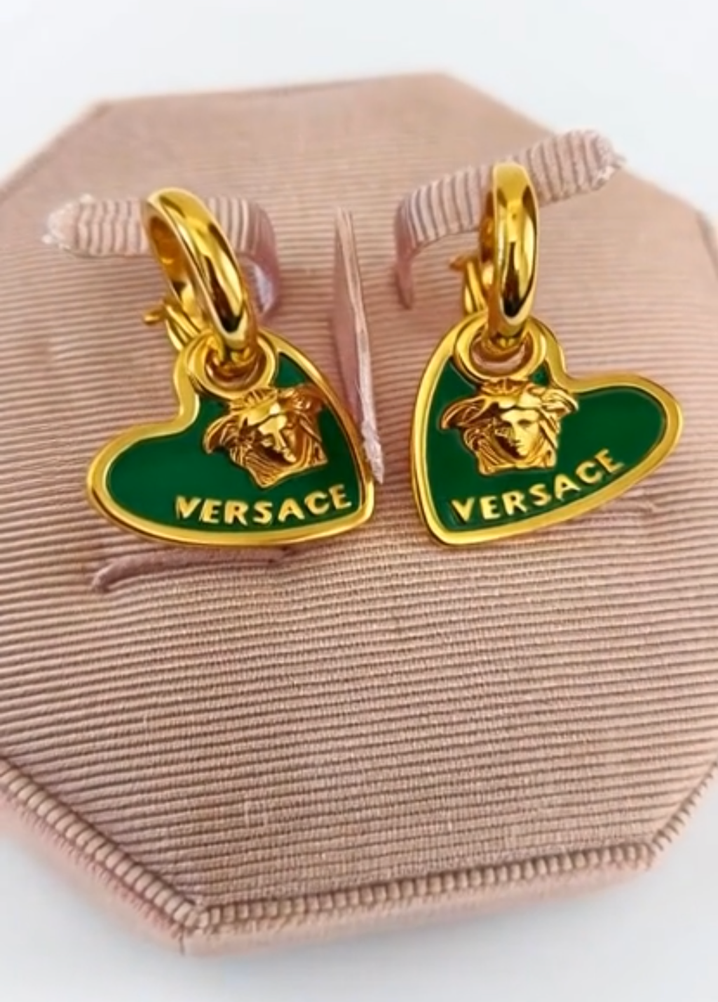 Versace earrings with green heart design and gold accents 