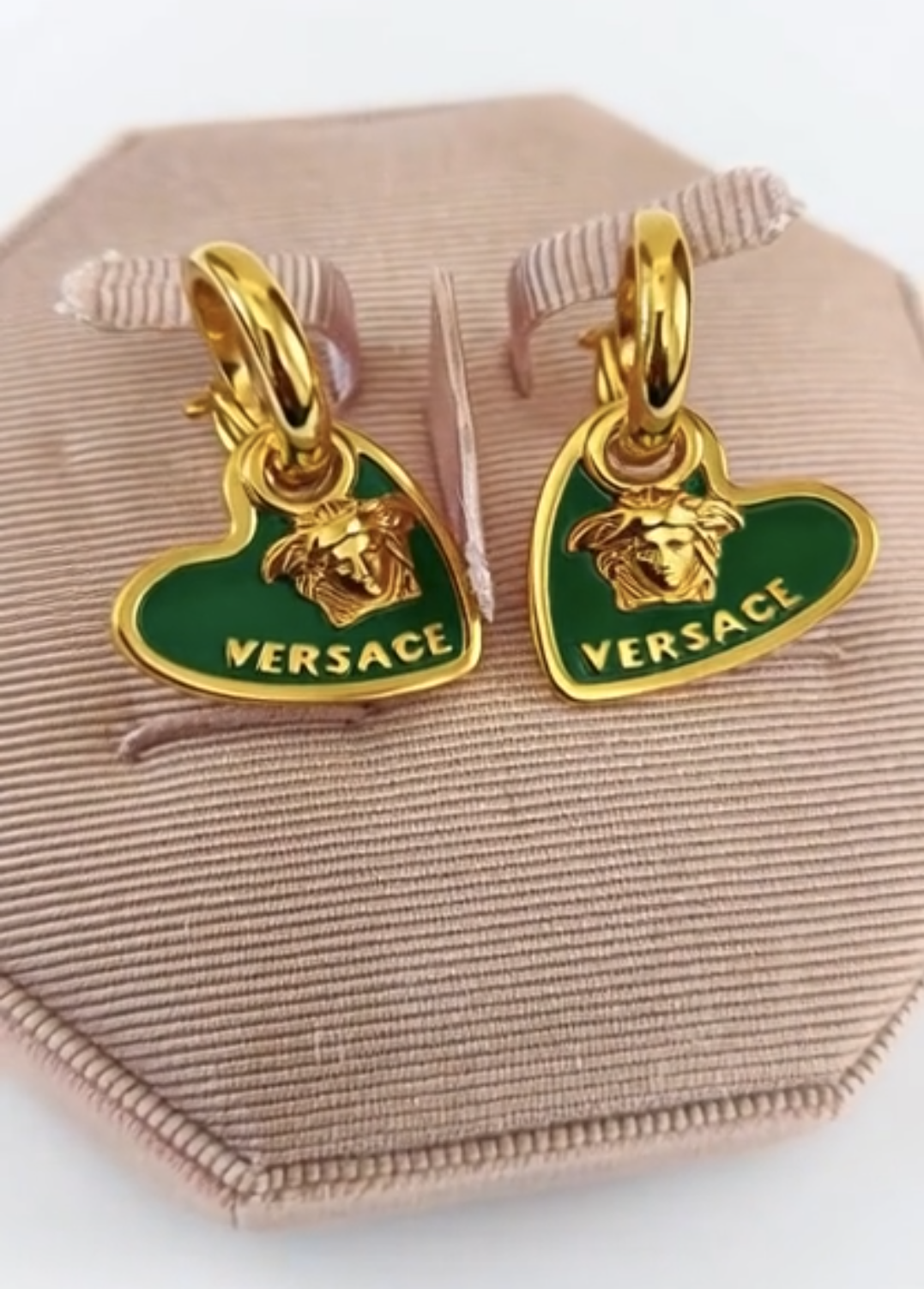 Versace earrings with green heart design and gold accents 